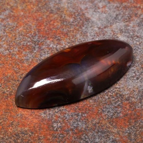 Fire Agate cabochon coyrage, depth and expression